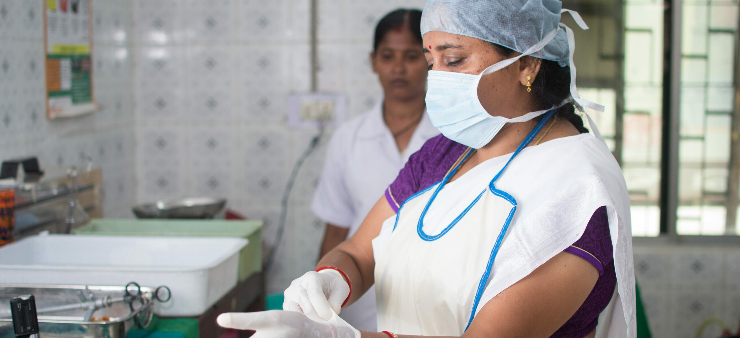 India/City Hospital- Cuttack: Following infection prevention protocols is at the center of establishing quality FP services. Here a staff nurse prepares for a tubal ligation procedure.